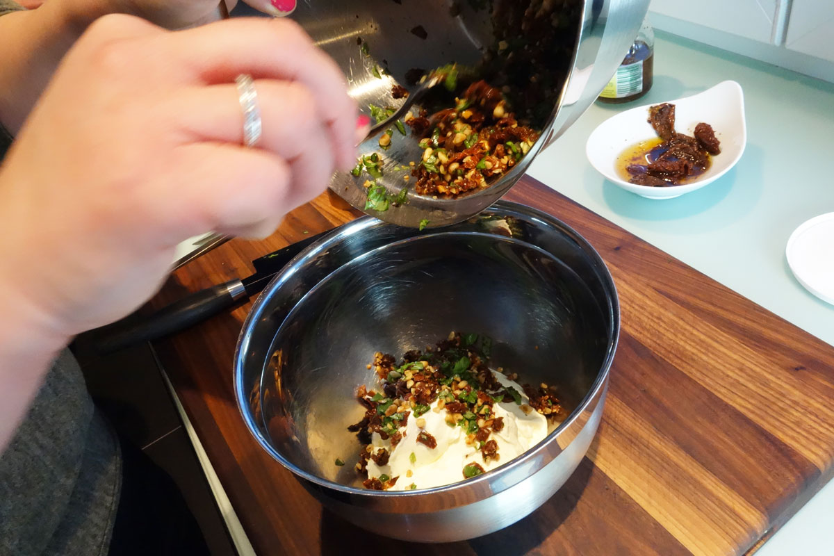 add basil-pine nut mixture, salt and pepper generously and mix well